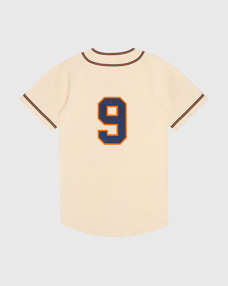 Cream-colored short-sleeved Ebbets Field San Francisco Sea Lions Cotton Twill Baseball Jersey with dark blue and orange trim and the number 9 in dark blue and orange on the back.