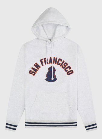 Ebbets Field San Francisco Sea Lions Heavyweight Cotton Terry Pullover Hoodie in light gray heather with a kangaroo pocket, navy and orange lettering, a navy seal graphic, and striped cuffs and hem.