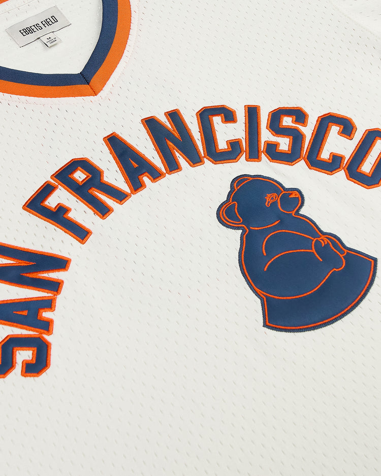 Ebbets Field San Francisco Sea Lions V-Neck Mesh Jersey in white, featuring the text SAN FRANCISCO and a sea lion graphic in blue and orange embroidery.
