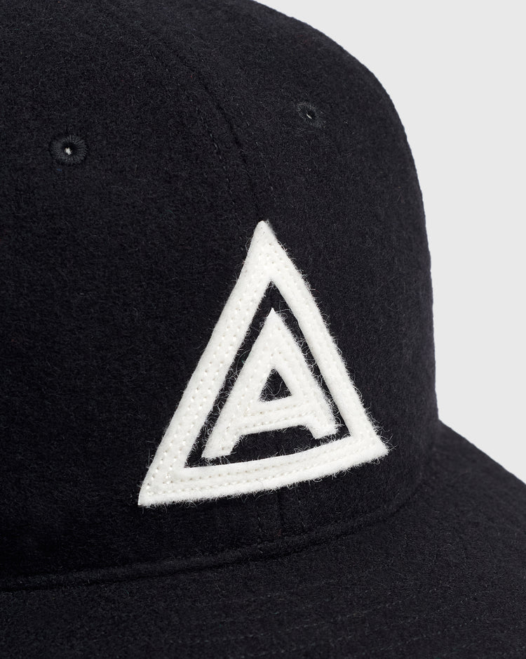 Mystery Caps of Mexico – Agrario de México 1935 Wool Ballcap by Ebbets Field: a black wool baseball cap featuring a white embroidered letter A inside a white triangle.