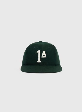 Dark green wool Mystery Caps of Mexico – Artelleria de México 1926 Wool Ballcap with an embroidered white 1A on the front.