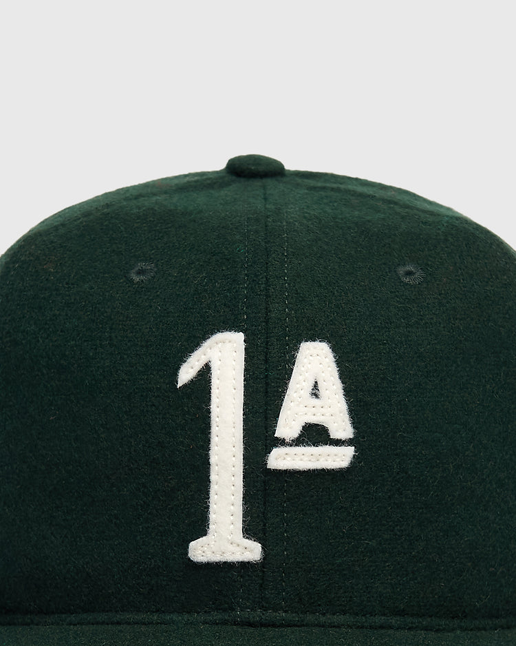 Dark green wool Mystery Caps of Mexico – Artelleria de México 1926 Wool Ballcap featuring a white felt appliqué of the characters 1ª.