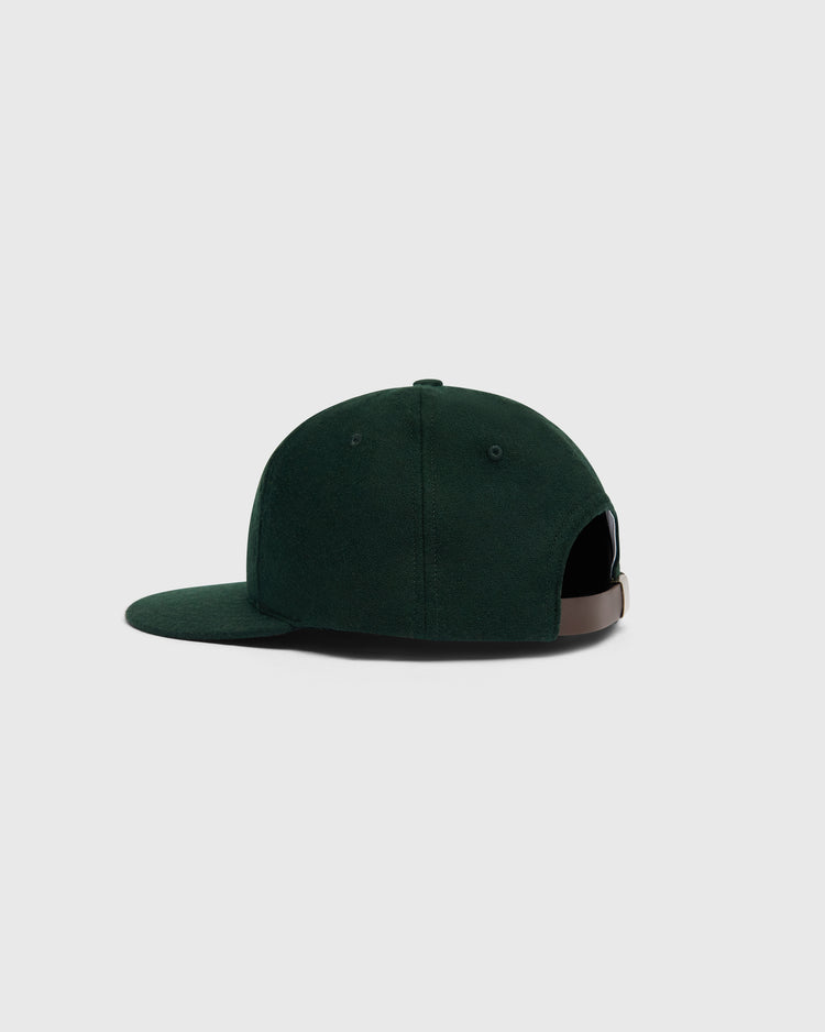 Mystery Caps of Mexico – Artelleria de México 1926 Wool Ballcap in dark green wool with a flat brim and an adjustable brown leather strap at the back.