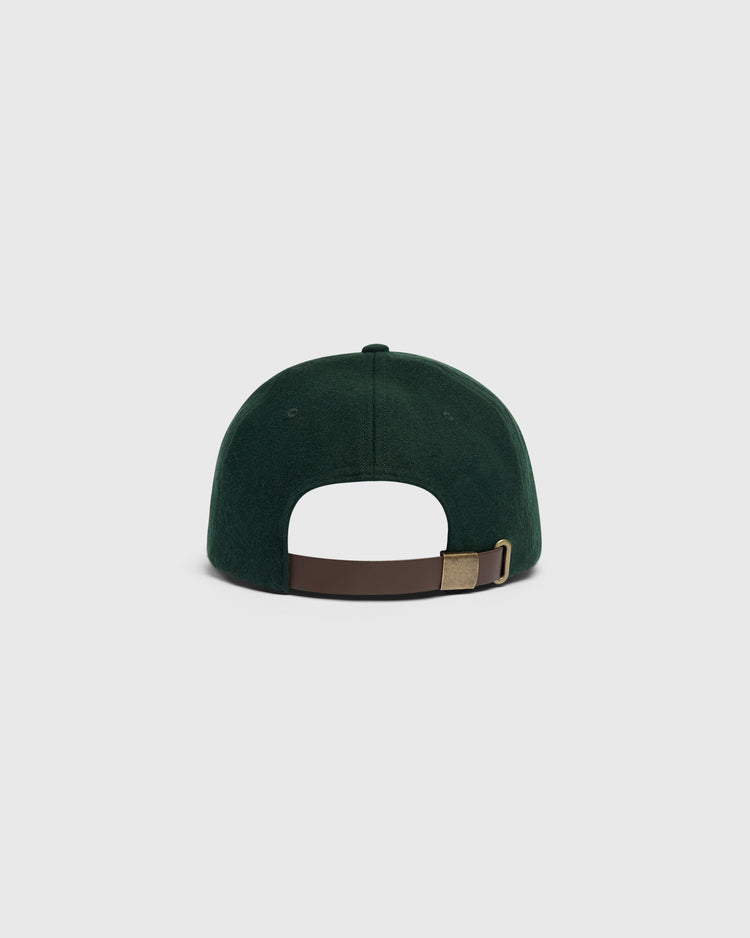 Back view of a dark green wool Ebbets Field Mystery Caps of Mexico – Artelleria de México 1926 Wool Ballcap, featuring an adjustable brown leather strap with a brass buckle.