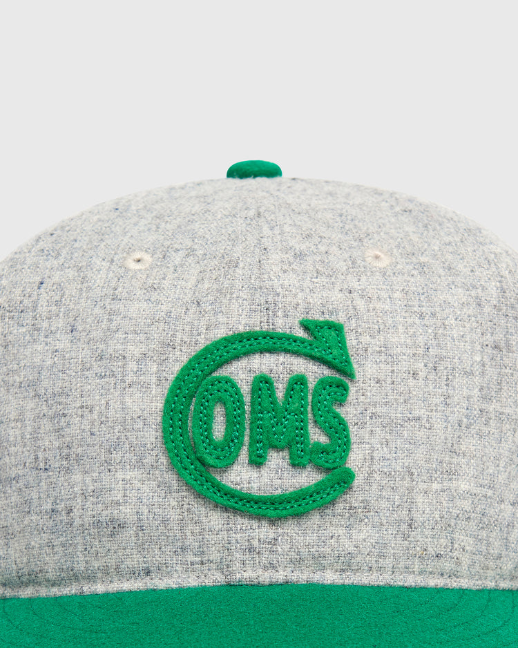 Mystery Caps of Mexico – Comunicaciones 1931 Wool Ballcap in grey wool, featuring a green embroidered OMS logo inside a circular arrow.