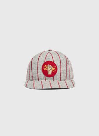 Ebbets Field Mystery Caps of Mexico – Electricistas De Necaxa 1935 Wool Ballcap in grey with red pinstripes and a circular patch on the front featuring a gold fist holding a lightning bolt on a red background.