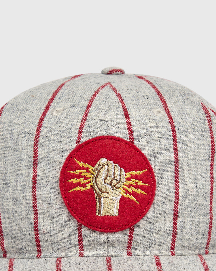 Ebbets Field Mystery Caps of Mexico – Electricistas De Necaxa 1935 Wool Ballcap in gray wool with thin red pinstripes and a circular red patch featuring an embroidered fist holding yellow lightning bolts.