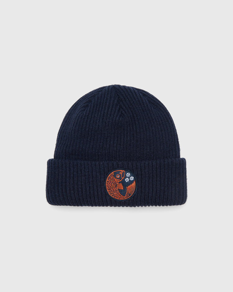 Navy blue ribbed knit Ebbets Field Hiroshima Carp Felt Patch Ribbed Beanie with a circular patch featuring an orange carp and a white baseball.