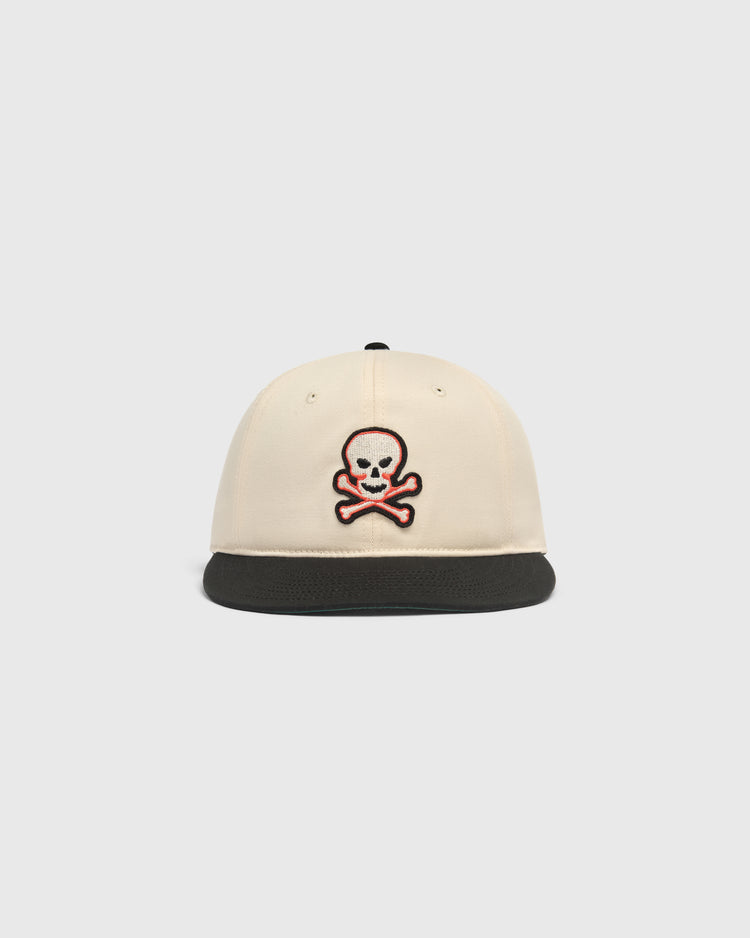 Off-white Sioux City Ghosts Cotton Twill Ballcap featuring a black brim and an embroidered skull and crossbones patch on the front.