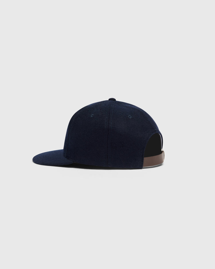 Mystery Caps of Mexico – La Junta de Nuevo Laredo 1940 Wool Ballcap by Ebbets Field: a dark navy wool baseball cap with a flat brim and a brown adjustable strap.