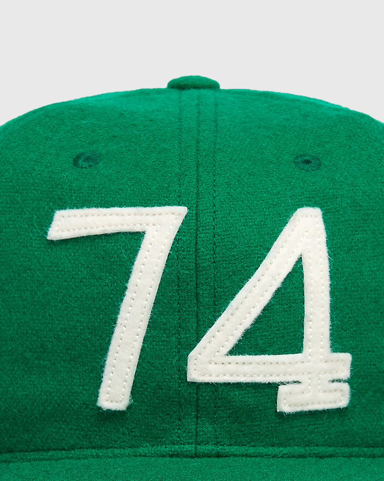 Ebbets Field Mystery Caps of Mexico – 74 Regimento de Puebla 1925 Wool Ballcap in green, featuring white felt numbers 74 stitched on the front.