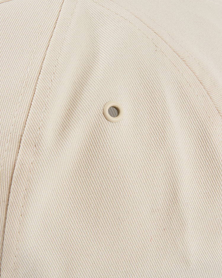 Close-up of the Ebbets Field Chicago Cats A-Frame Cotton Twill Ballcap in beige, featuring a stitched seam and a small round metal ventilation eyelet.
