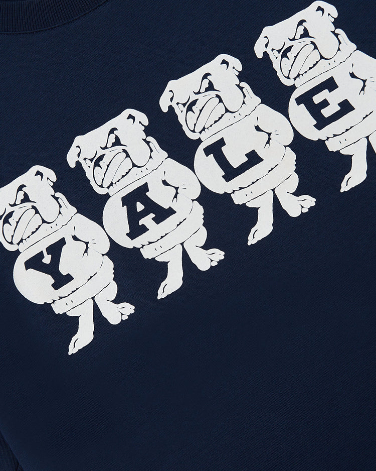 Five cartoon bulldogs in sweaters, each with a letter to spell YALE, appear on a dark blue Ebbets Field YALE SS TEE NAVY.