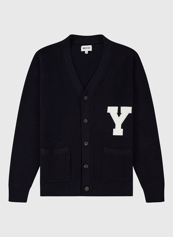 The Ebbets Field YALE VARSITY CARDIGAN Navy features a large white Y patch on the left chest, black buttons, and two front pockets. Shown against a plain light gray background.
