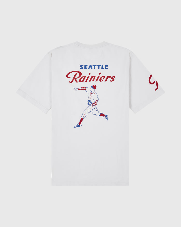 Ebbets Field Seattle Rainiers Ebbets Tee with Back Print: White tee with blue and red baseball player graphic, SEATTLE Rainiers above, and partially visible red text on the right sleeve.