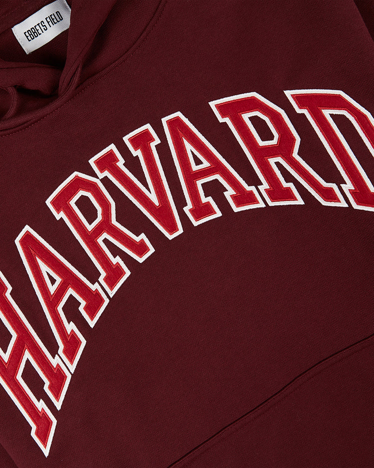The Ebbets Field HARVARD HOODIE MAR is maroon with HARVARD in bold white and red-outlined letters across the chest.
