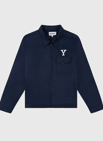 The Ebbets Field YALE GROUNDS CREW JACKET in navy features a zip-up front, collar, chest pocket with a white Y logo, and two side pockets, shown against a light gray background.