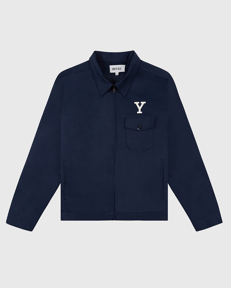 The Ebbets Field YALE GROUNDS CREW JACKET in navy features a zip-up front, collar, chest pocket with a white Y logo, and two side pockets, shown against a light gray background.