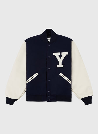 The YALE VARSITY JACKET Navy by Ebbets Field features white sleeves, ribbed cuffs, a large white Y patch on the chest, two white-trimmed pockets, and front snap buttons.