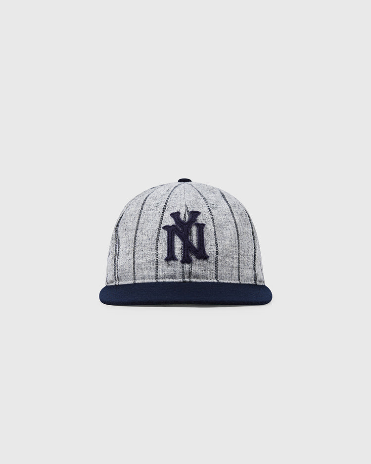The NEW Bronx Giants 1922 Vintage Ballcap by Ebbets Field features gray fabric with dark pinstripes, a navy blue brim, and a navy embroidered logo, shown against a plain light background.
