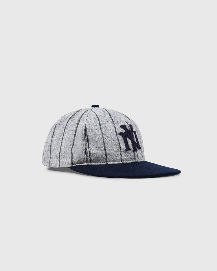 The NEW - Bronx Giants 1922 Vintage Ballcap by Ebbets Field features a gray crown with thin black stripes, a navy blue bill, and a navy NY logo on the front, shown against a plain light background.