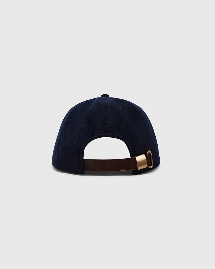 The Chicago Whales 1915 Authentic 8-Panel Soft Short Brim Ballcap by EFF is shown from the back in navy blue, with a brown adjustable strap and brass buckle, set against a light gray background.