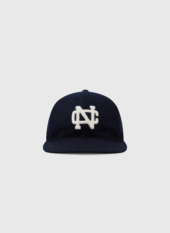 The Ebbets Field Flannels University of North Carolina 1960 Vintage Ballcap is a navy wool cap featuring a white embroidered NC logo, inspired by the original 1960 design and shown against a plain light gray background.