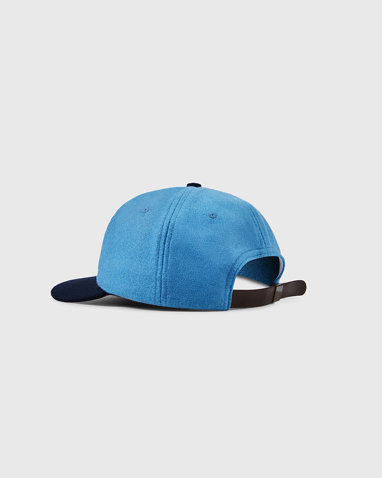 The EFF University of North Carolina 1983 Vintage Ballcap features a light blue crown, dark navy brim, and an adjustable brown strap, displayed against a plain light gray background.