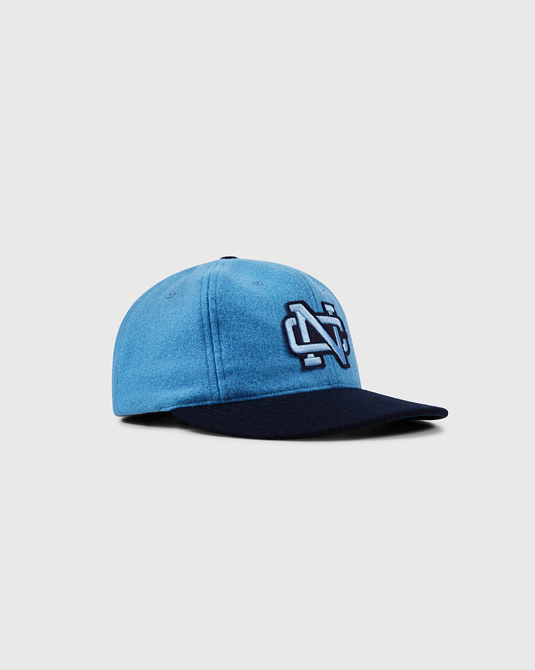 The EFF University of North Carolina 1983 Vintage Ballcap features a blue crown, navy brim, and white/navy embroidered NC logo on the front, shown on a plain light gray background.
