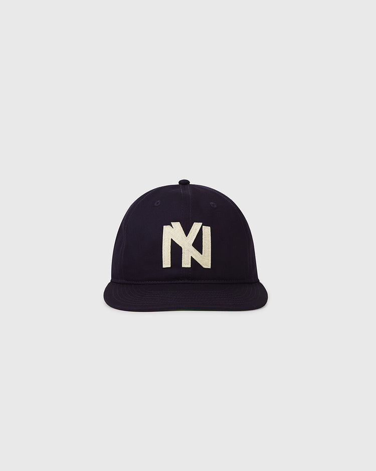 The Ebbets Field Brooklyn Eagles 1935 Cotton Twill Ballcap features a dark navy blue vintage design with a cream NY logo on the front, shown against a plain light gray background.