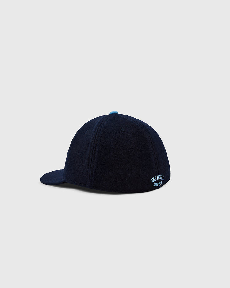 The EFF University of North Carolina Mascot Vintage Ballcap is a navy blue wool hat viewed from the back, featuring FOUR MINDS and 1997-97 embroidered in white on the lower right, set against a plain light gray background.