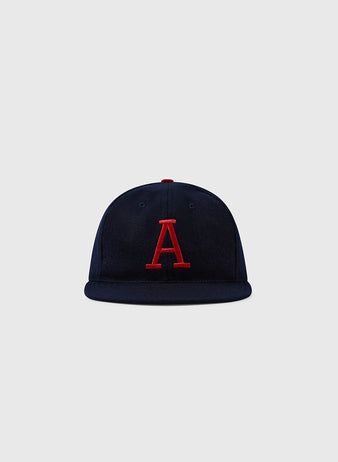 The EFF University of Arizona 1963 Vintage Ballcap features navy blue wool and a red, uppercase A on the front, shown against a light gray background. A must-have for Wildcats fans inspired by the classic 1963 cap.