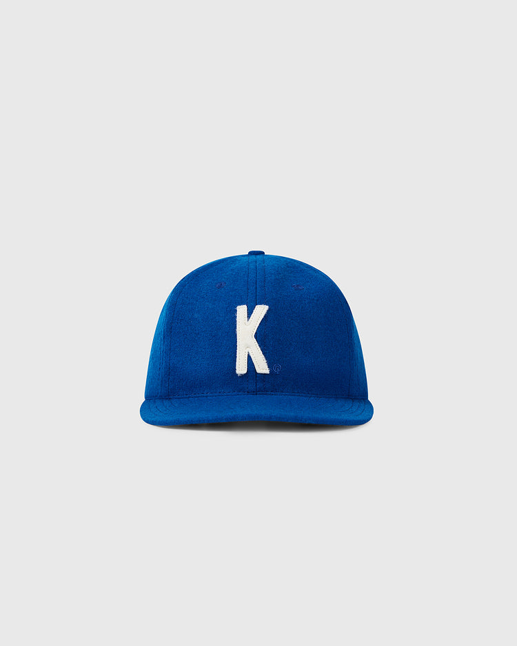 The EFF University of Kentucky 1964 Vintage Ballcap features royal blue fabric with a white embroidered “K” on the front, authentically reproduced and shown against a plain light gray background.