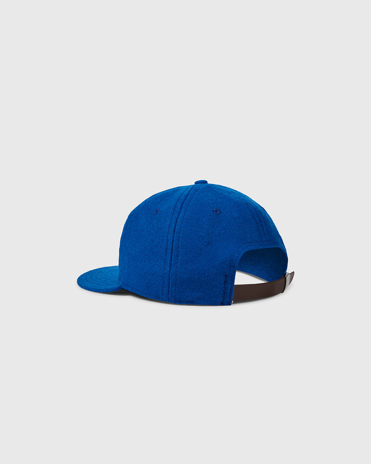 The EFF University of Kentucky 1964 Vintage Ballcap features blue textured fabric, a curved brim, brown adjustable strap, and is shown from the back against a plain light gray background. This is an authentic reproduction of the original ballcap.