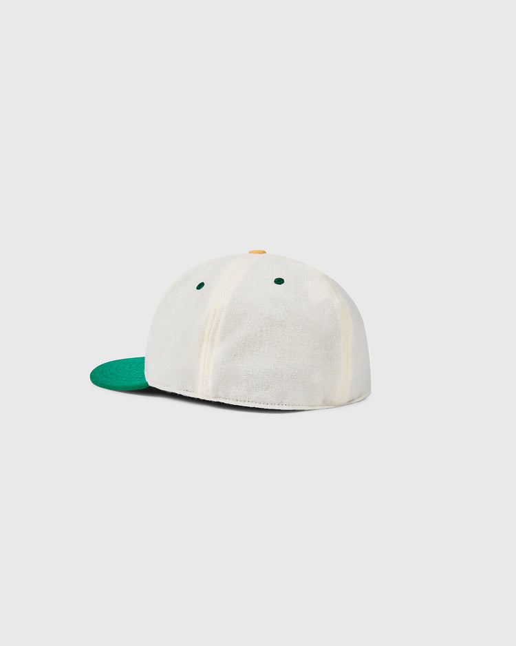 The EFF University of San Francisco Collegiate Wool Ballcap features a white design with a green brim, displayed from the back and side on a light gray background—a vintage-inspired collegiate baseball hat.