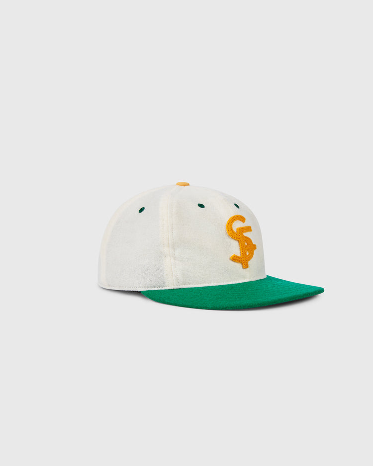 The EFF University of San Francisco Collegiate Wool Ballcap features cream wool, a green brim, and a yellow CS logo, evoking the 1947 USF cap. Displayed on a plain white background.