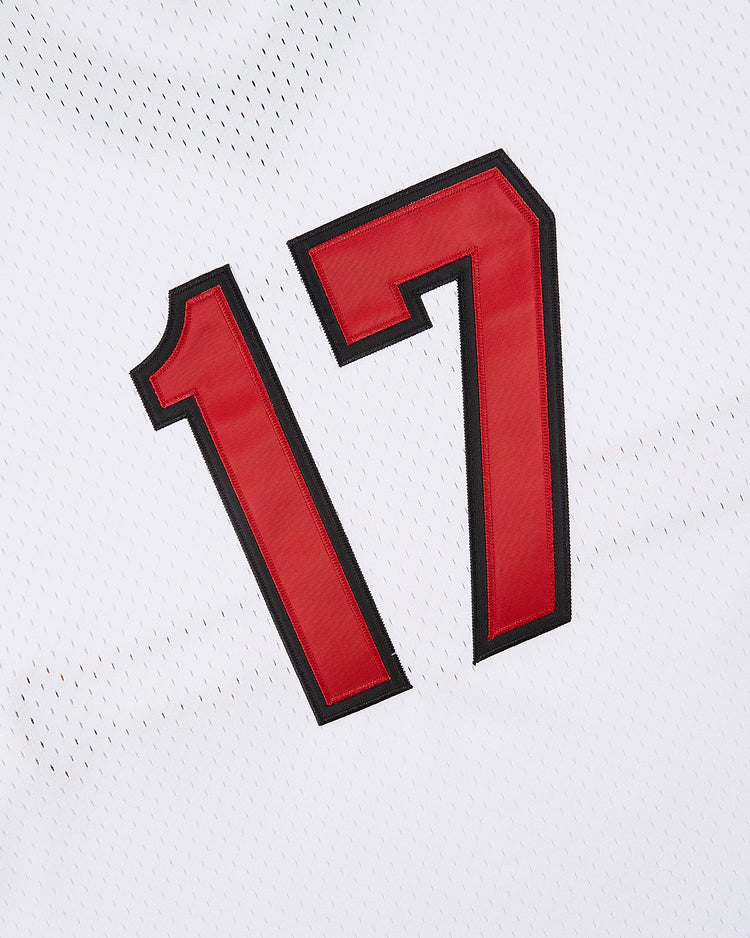 Close-up of the bold red number 17 with black outline on a white Topeka Owls V-Neck Mesh Jersey by Ebbets Field, inspired by the classic minor league team uniform.