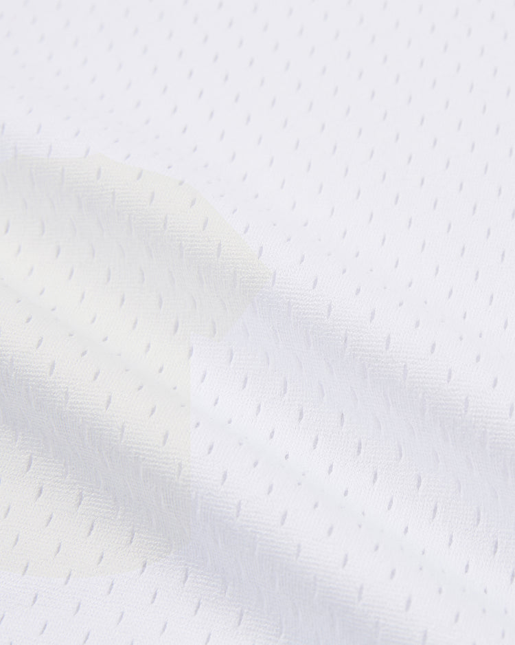 Close-up of the Ebbets Field Topeka Owls V-Neck Mesh Jersey shows white athletic mesh fabric with small holes and subtle wrinkles, emphasizing the breathable texture and vintage style of this classic throwback uniform.