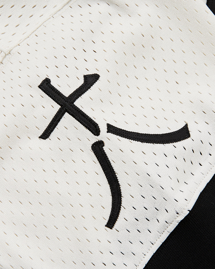Close-up of the white mesh fabric and stitched black abstract design on the Ebbets Field Tokyo Giants Mesh V-Neck Jersey, echoing the iconic style of Victor Starffin’s early Japanese Baseball League uniform.