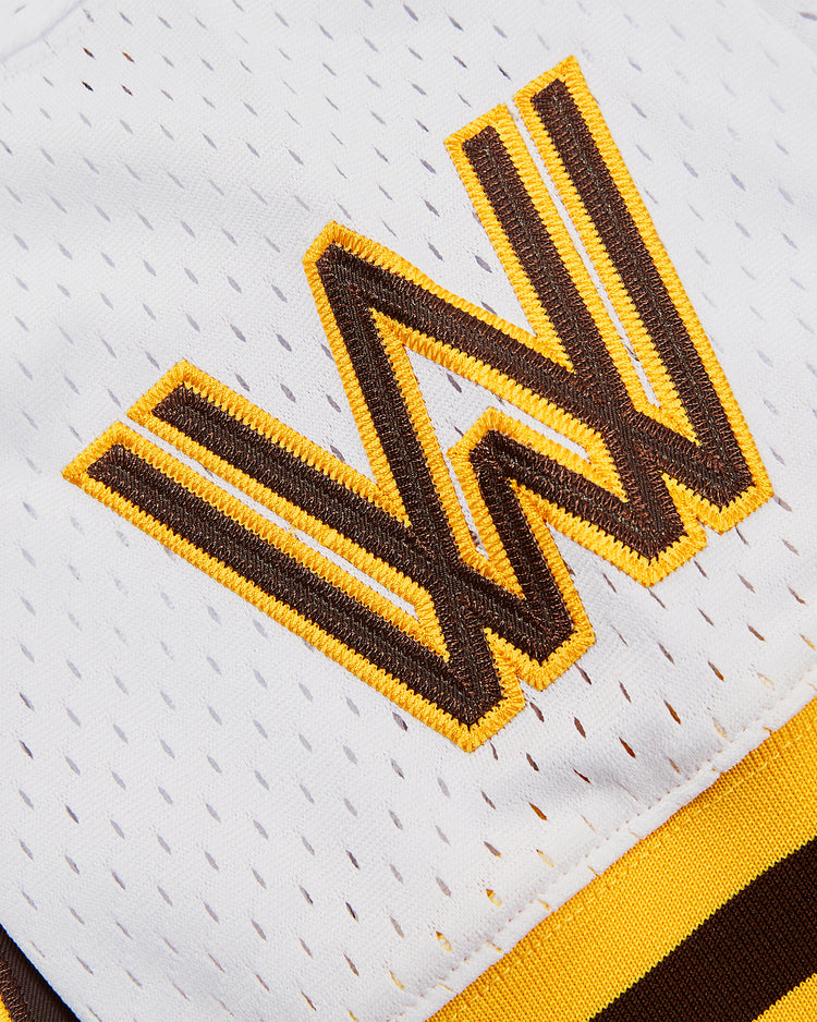 A close-up of the Ebbets Field Ozzie Smith Walla Walla Padres Mesh V-Neck Jersey shows a large, embroidered yellow and brown 