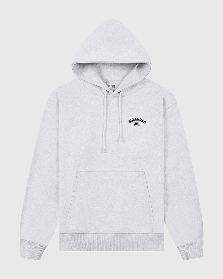 Light gray Muhammad Ali Chest Embroidered Heavyweight Cotton Terry Pullover Hoodie by Ebbets Field, with front pocket and drawstrings, featuring small black “MUHAMMAD ALI” text on the left chest—exclusive to our Thrilla in Manila collection.