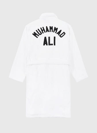 The Muhammad Ali Cotton Terry Boxing Robe by Ebbets Field is seen from the back, featuring bold black 