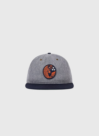 The Ebbets Field Hiroshima Carp Cotton Twill Ballcap is a grey cap with a black brim and an orange and black fish patch inspired by the Hiroshima Carp, shown here on a plain white background.