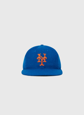 The Ebbets Field New York Mets 1962 MLB Authentic Wool Ballcap is blue with an orange NY logo, inspired by the original on-field cap and shown against a plain light gray background.