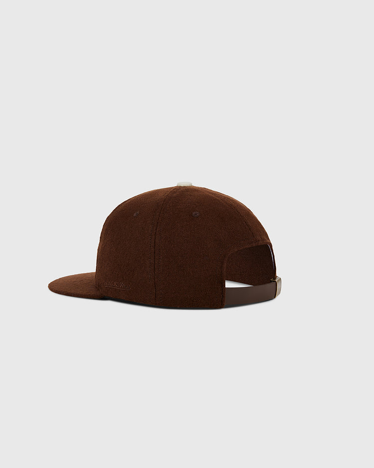 The Ebbets Field St. Louis Browns 1953 MLB Authentic Wool Ballcap is shown from the back, displaying its brown color, curved brim, and adjustable leather strap closure against a plain light gray background.