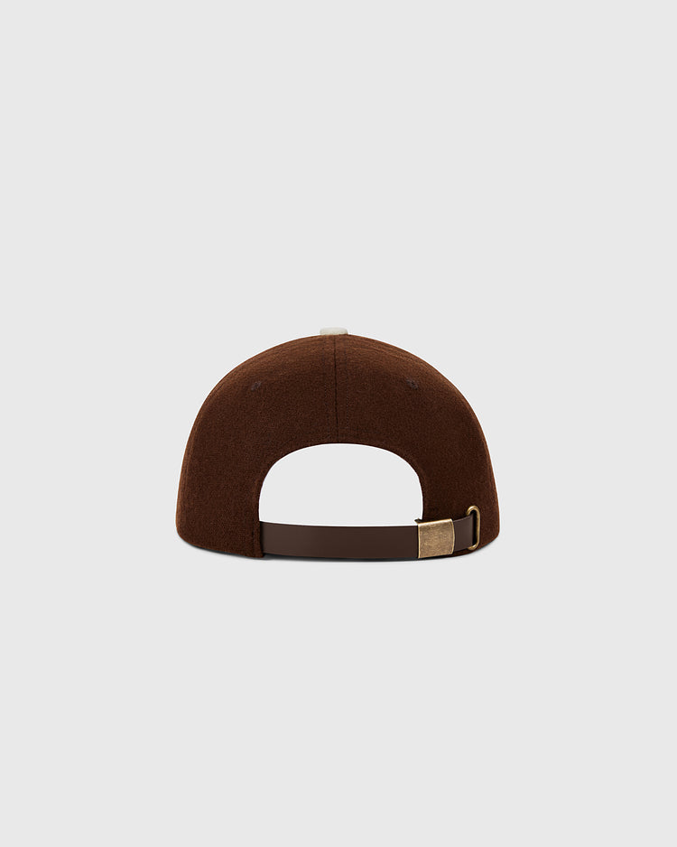 The Ebbets Field St. Louis Browns 1953 MLB Authentic Wool Ballcap, seen from the back with a dark brown adjustable strap and brass buckle, is part of the Decade of Change Collection against a plain light gray background.