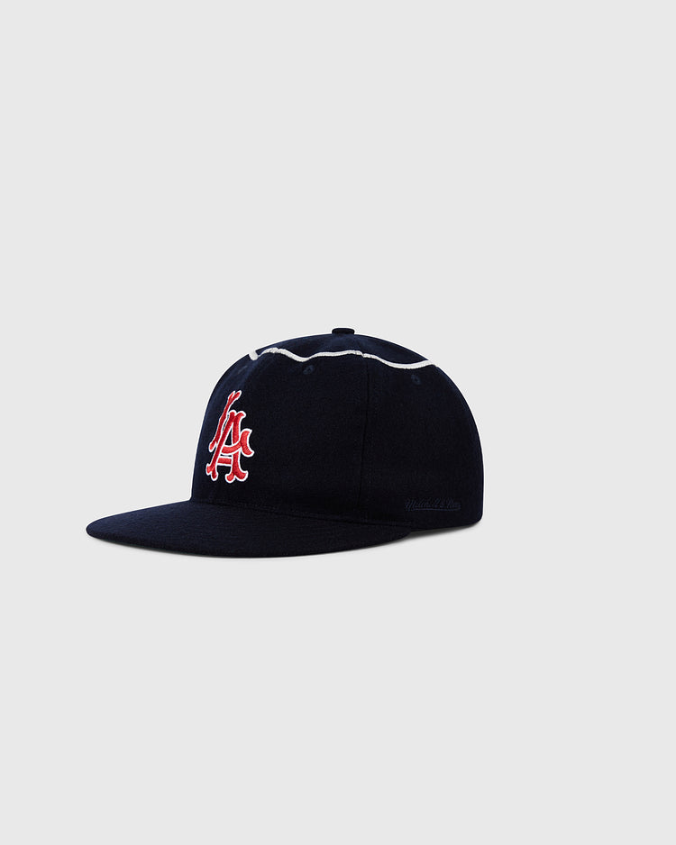 The Ebbets Field Los Angeles Angels 1961 MLB Authentic Wool Ballcap features a navy blue design with a red and white embroidered A logo, white piping on the seams, and a flat brim—ideal for vintage MLB hat collectors. Shown on a plain gray background.