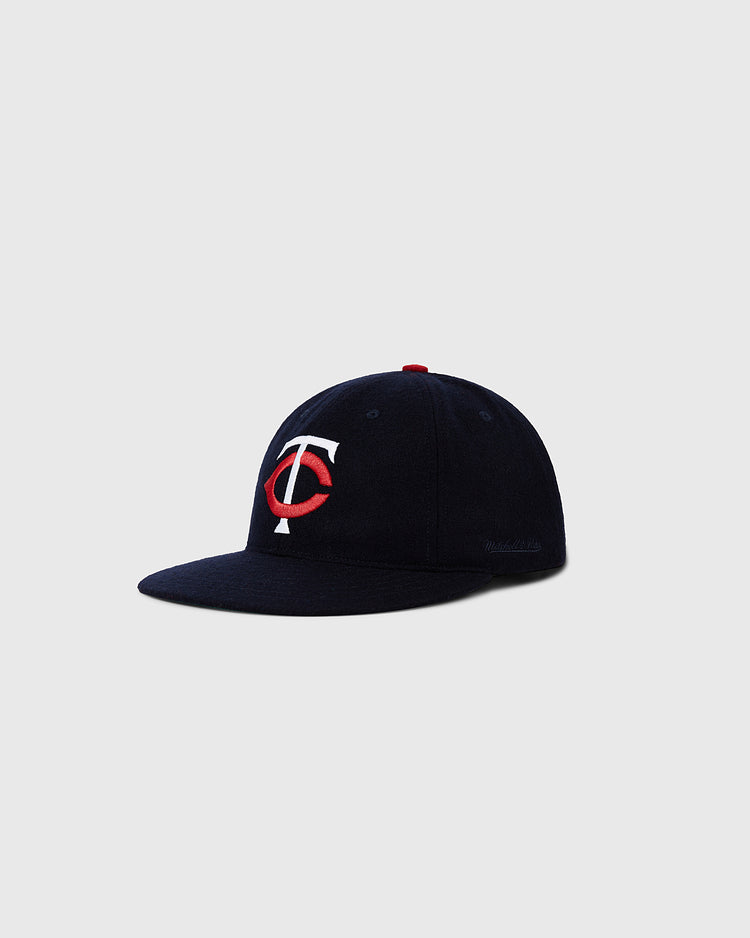 The Ebbets Field Minnesota Twin 1961 MLB Authentic Wool Ballcap, in navy with a red and white TC logo, is shown on a light gray background.