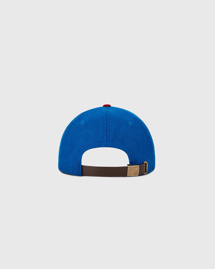The Ebbets Field Chicago Cubs 1956 MLB Authentic Wool Ballcap, shown from the back, features a brown adjustable strap with a brass buckle against a plain light gray background. Part of the Decade of Change Collection.