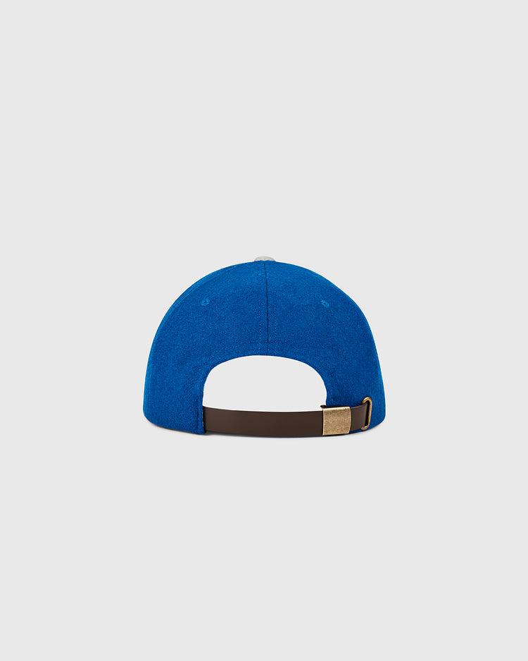 The Ebbets Field Los Angeles Dodgers 1958 MLB Authentic Wool Ballcap is shown from the back, highlighting a brown adjustable strap with brass buckle, set against a plain light gray background. Part of the Decade of Change Collection.